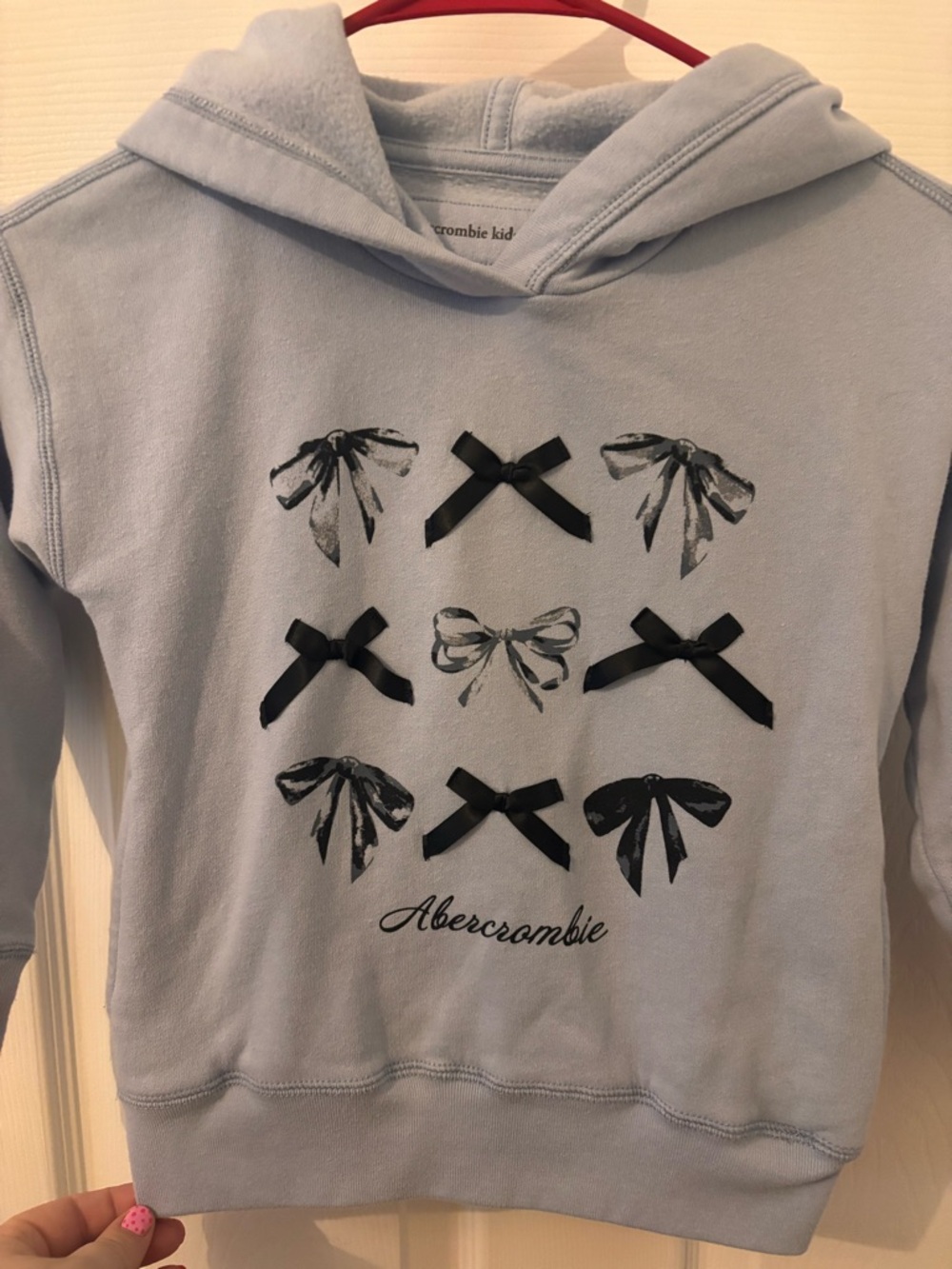 abercrombie kids light blue hoodie with black bow accents